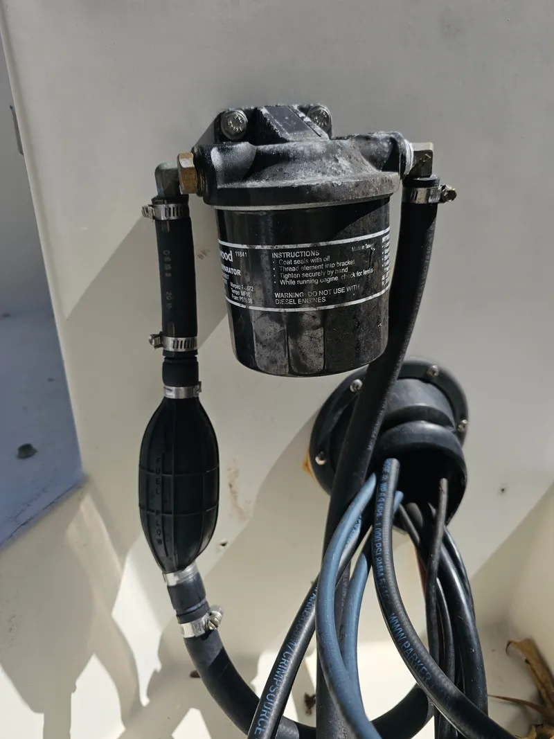 Slide: The Image of Fuel filter and hoses in a 1990 Hydra-Sports 2000 DC boat. - 16