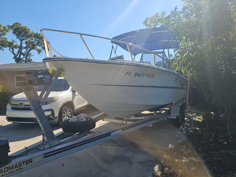 Slide: The Image of 1990 Hydra-Sports 2000 DC boat on trailer in sunlight. - 2