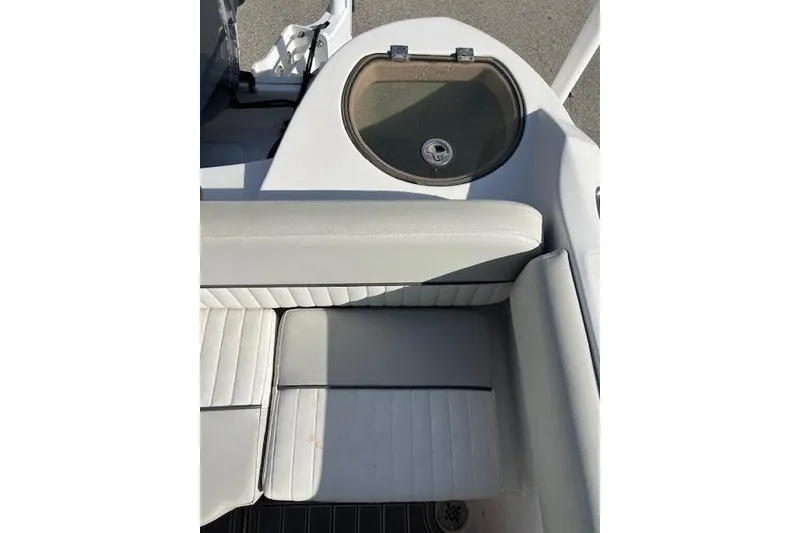 Slide: The Image of 2021 Sea Fox 226 Traveler boat interior with cushioned seating and livewell. - 2