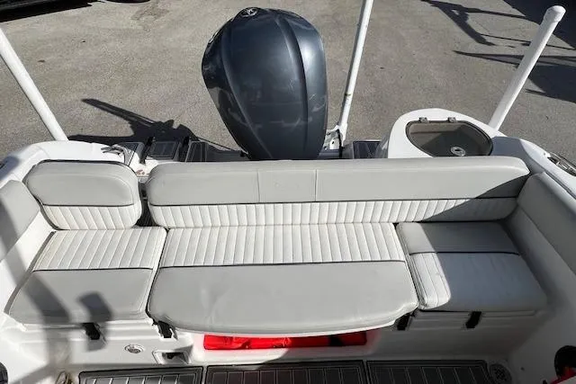 Slide: The Image of 2021 Sea Fox 226 Traveler boat with cushioned seating and outboard motor. - 3