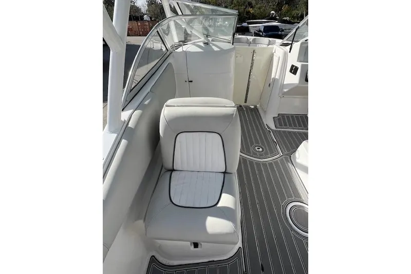 Slide: The Image of 2021 Sea Fox 226 Traveler boat interior with white seating and sleek flooring. - 4