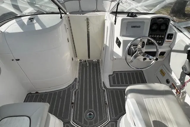 Slide: The Image of 2021 Sea Fox 226 Traveler boat interior with steering wheel and Simrad display. - 5
