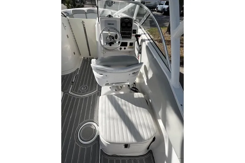 Slide: The Image of 2021 Sea Fox 226 Traveler boat interior with steering console and seating. - 6