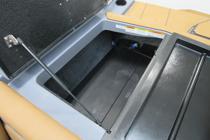 Slide: The Image of Open storage compartment in 2026 Axis A225 boat, featuring hydraulic lift support. - 12