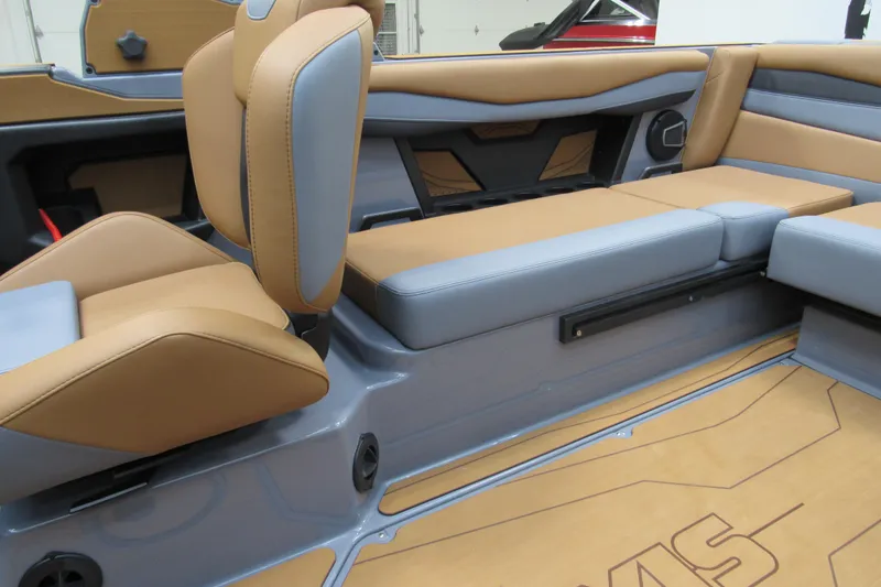 Slide: The Image of 2026 Axis A225 boat interior with tan and gray seating, modern design. - 13
