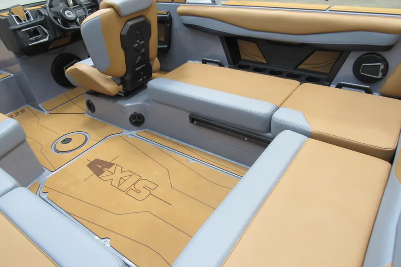 Slide: The Image of 2026 Axis A225 boat interior with tan and gray seating, modern design. - 6