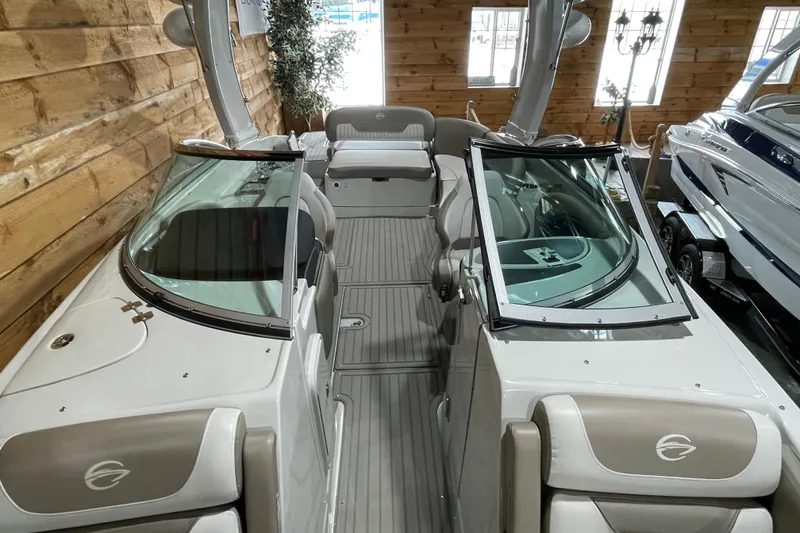 Slide: The Image of 2026 Crownline 298 SS boat interior with sleek design and comfortable seating. - 11