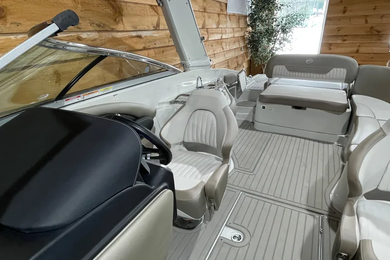 Slide: The Image of 2026 Crownline 298 SS boat interior with luxurious seating and modern design. - 14