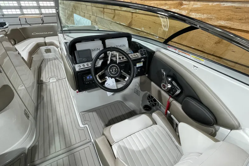 Slide: The Image of 2026 Crownline 298 SS boat interior with modern dashboard and steering wheel. - 7