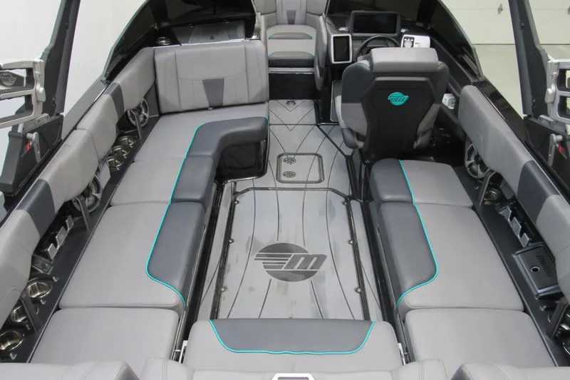 Slide: The Image of 2021 Malibu Wakesetter 23 LSV interior with sleek gray seating and modern dashboard. - 4
