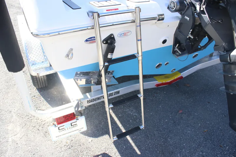 Slide: The Image of 2026 Tidewater 210 LXF boat rear view with ladder and trailer details. - 18