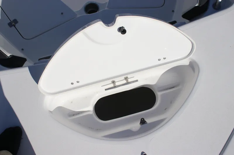 Slide: The Image of 2026 Tidewater 210 LXF boat storage compartment with open hatch, showcasing interior design. - 22