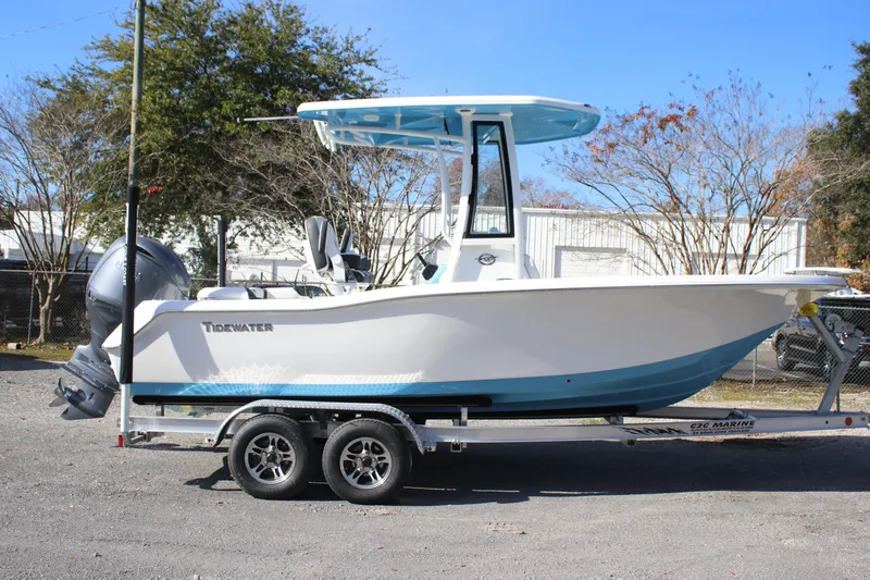 Slide: The Image of 2026 Tidewater 210 LXF boat on trailer, parked outdoors, side view. - 3