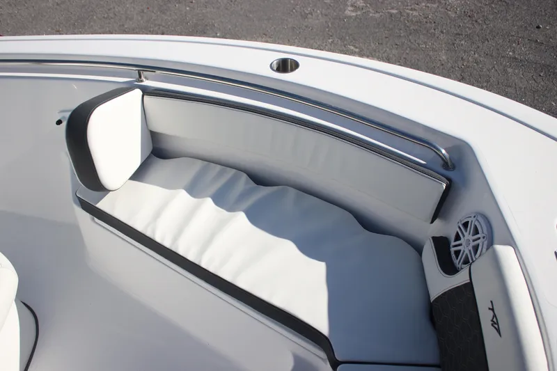 Slide: The Image of 2026 Tidewater 210 LXF boat interior with cushioned seating and stainless steel rail. - 31