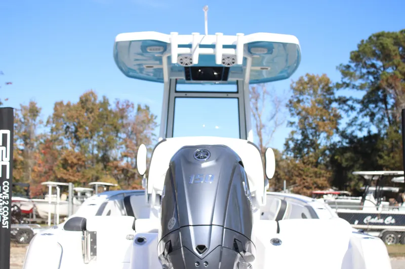 Slide: The Image of 2026 Tidewater 210 LXF boat with powerful outboard motor, showcased outdoors. - 5