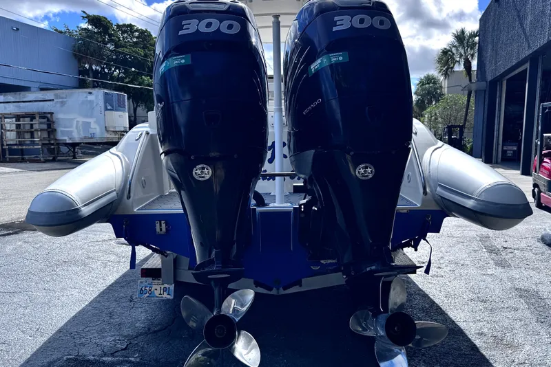 Slide: The Image of Rear view of a 2014 Airship 330 boat with dual 300 horsepower engines. - 4