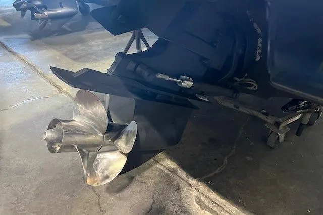 Slide: The Image of Propeller of 2016 Sea Ray 250 SLX boat in a garage setting. - 12