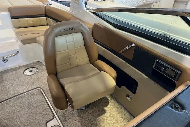 Slide: The Image of Interior of 2016 Sea Ray 250 SLX boat with tan leather seating and modern design. - 20