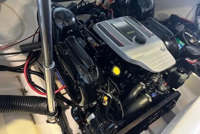Slide: The Image of Engine compartment of a 2016 Sea Ray 250 SLX boat, showcasing detailed components. - 24