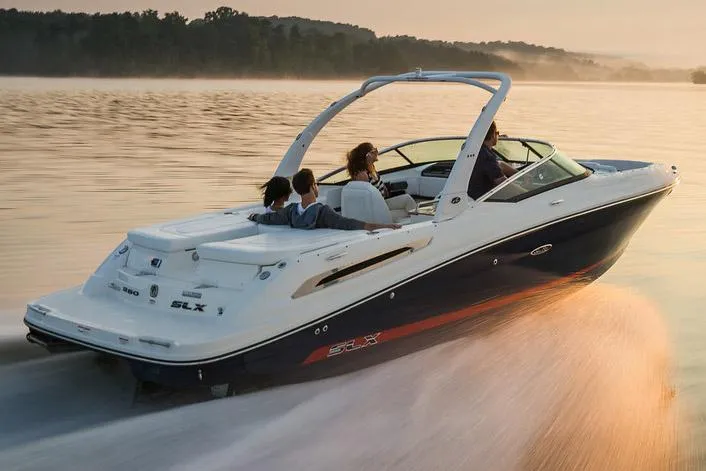 Slide: The Image of Manufacturer Provided Image: 2015 Sea Ray 250 SLX speedboat cruising on a serene lake at sunset. - 28