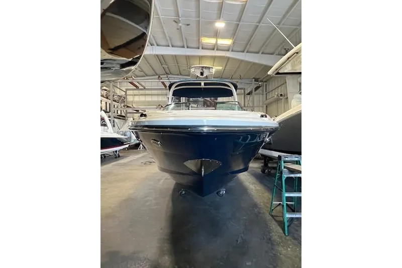Slide: The Image of 2016 Sea Ray 250 SLX boat in storage facility, front view. - 3