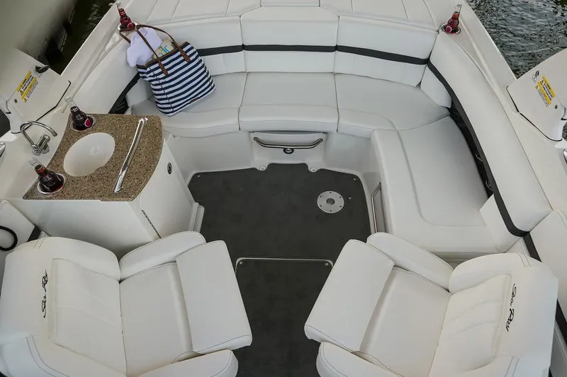 Slide: The Image of Manufacturer Provided Image: 2015 Sea Ray 250 SLX boat interior with white seating and a small sink. - 31
