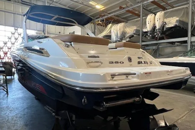 Slide: The Image of 2016 Sea Ray 250 SLX boat in indoor storage, rear view. - 5