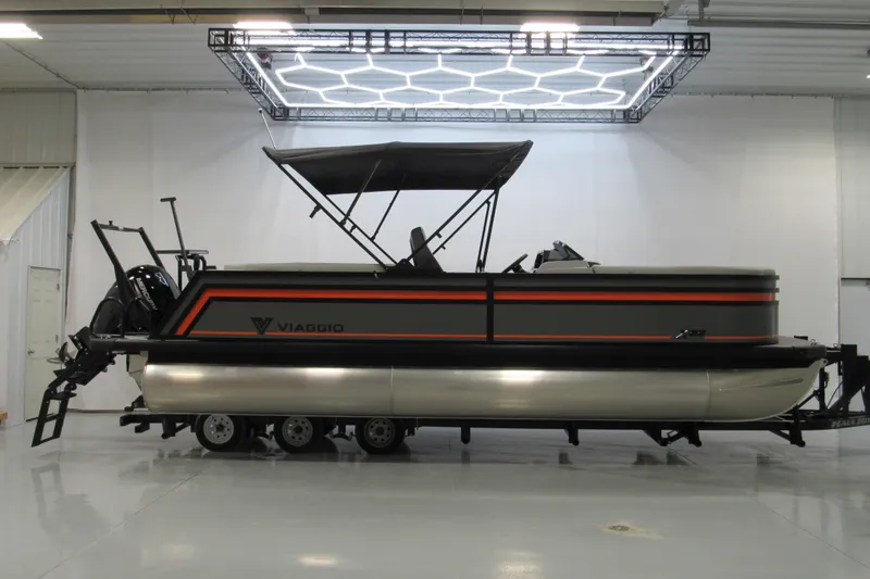 The Image of 2026 Viaggio Lago V22U pontoon boat on trailer in showroom. - 0
