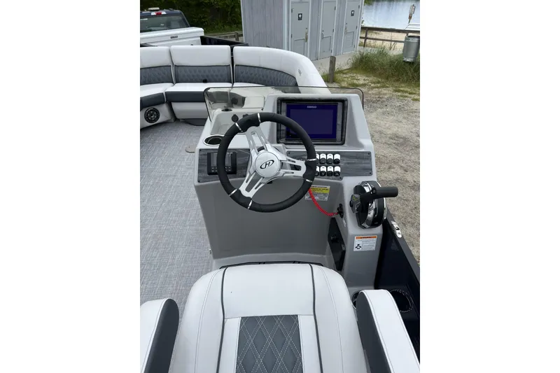 Slide: The Image of 2021 Harris FloteBote Sunliner 230 helm with steering wheel and control panel. - 5