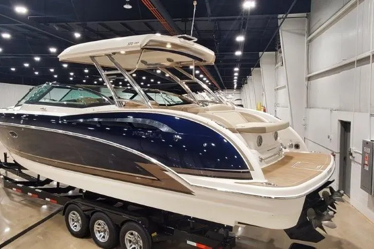Slide: The Image of 2017 Formula 350 Crossover Bowrider on trailer in indoor showroom. - 1