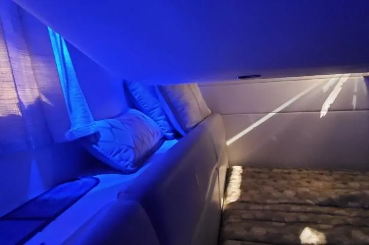 Slide: The Image of 2017 Formula 350 Crossover Bowrider interior with blue ambient lighting and cozy seating. - 10