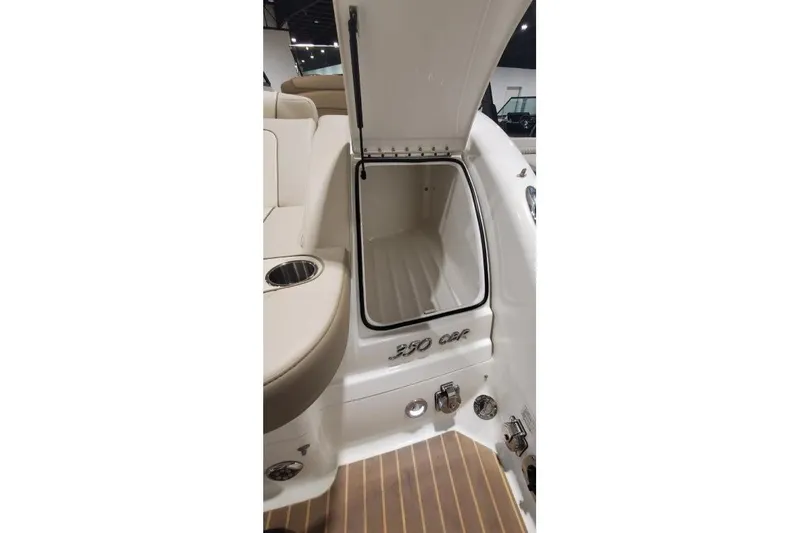 Slide: The Image of 2017 Formula 350 Crossover Bowrider storage compartment with open hatch and seating area. - 13