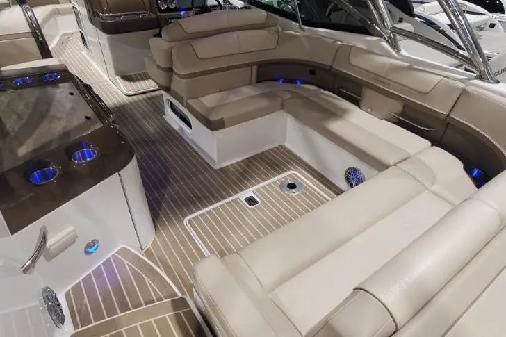 Slide: The Image of Luxurious interior of 2017 Formula 350 Crossover Bowrider with beige seating and wood flooring. - 15