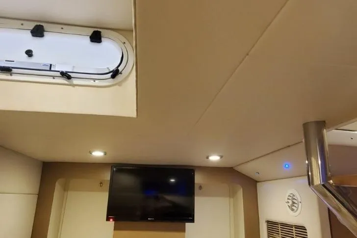 Slide: The Image of Interior of a 2017 Formula 350 Crossover Bowrider with TV and ceiling lights. - 17
