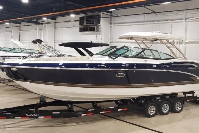 Slide: The Image of 2017 Formula 350 Crossover Bowrider on trailer in indoor showroom. - 2