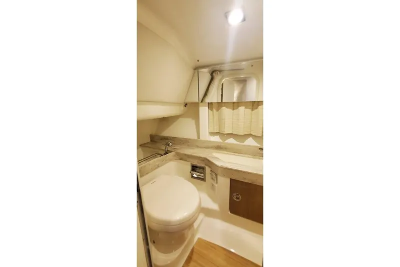 Slide: The Image of 2017 Formula 350 Crossover Bowrider bathroom with modern fixtures and compact design. - 20