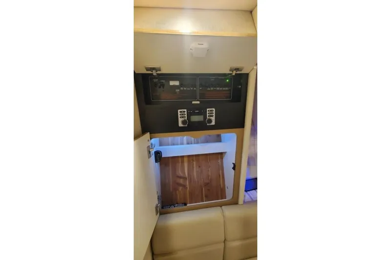 Slide: The Image of 2017 Formula 350 Crossover Bowrider interior control panel and storage compartment. - 27