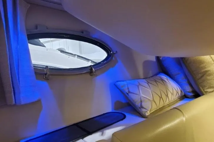 Slide: The Image of 2017 Formula 350 Crossover Bowrider cabin interior with blue ambient lighting and porthole. - 28