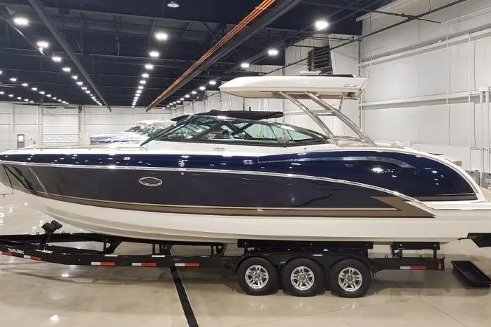 Slide: The Image of 2017 Formula 350 Crossover Bowrider in showroom, sleek design, on trailer. - 3