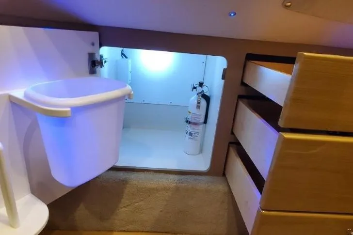 Slide: The Image of Interior of 2017 Formula 350 Crossover Bowrider with storage, fire extinguisher, and waste bin. - 31