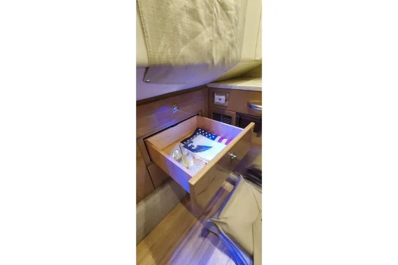 Slide: The Image of Open drawer in 2017 Formula 350 Crossover Bowrider, featuring American flag and ambient lighting. - 33