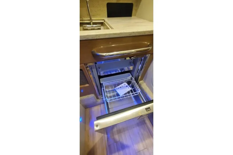 Slide: The Image of 2017 Formula 350 Crossover Bowrider interior with open drawer and sink. - 37