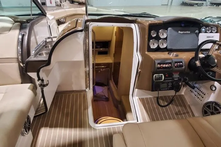 Slide: The Image of 2017 Formula 350 Crossover Bowrider interior with helm, cabin entrance, and modern controls. - 39