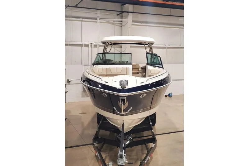 Slide: The Image of 2017 Formula 350 Crossover Bowrider in a showroom, front view on trailer. - 4