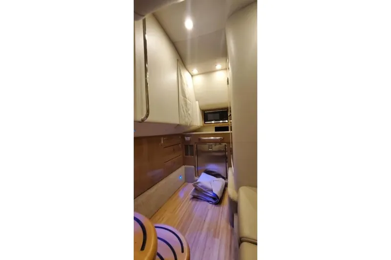 Slide: The Image of Interior of 2017 Formula 350 Crossover Bowrider, featuring modern cabinetry and lighting. - 42
