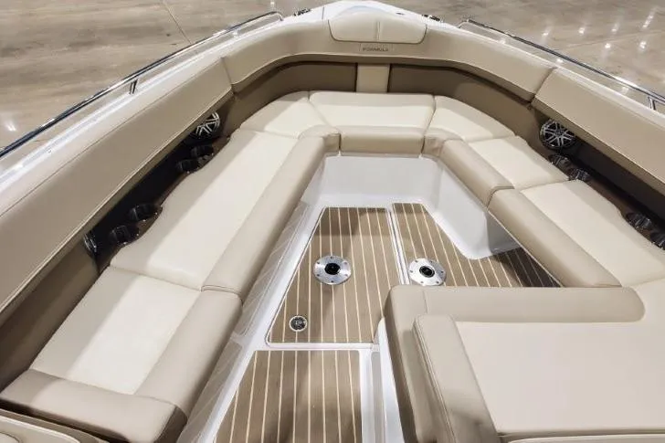 Slide: The Image of 2017 Formula 350 Crossover Bowrider interior with beige seating and wood-style flooring. - 45