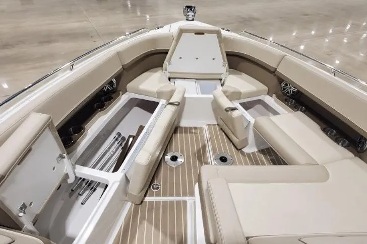 Slide: The Image of 2017 Formula 350 Crossover Bowrider interior with beige seating and storage compartments. - 46