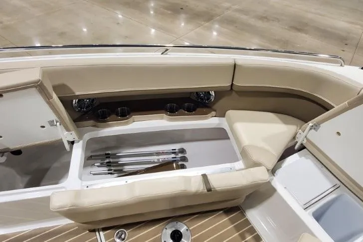 Slide: The Image of 2017 Formula 350 Crossover Bowrider interior with beige seating and storage compartments. - 47
