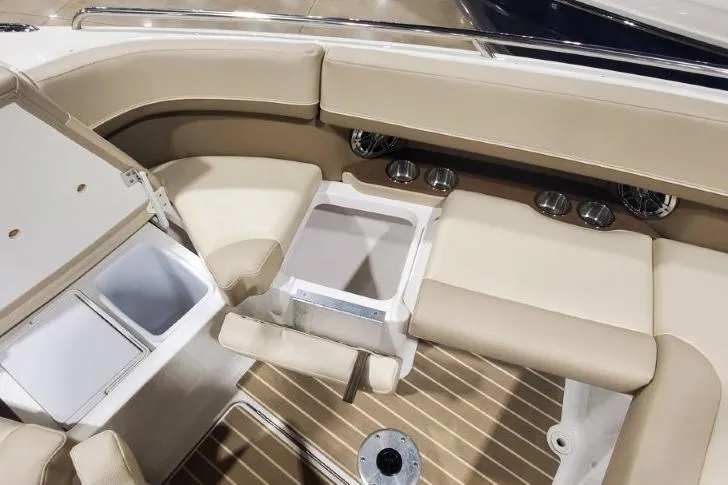 Slide: The Image of 2017 Formula 350 Crossover Bowrider interior with beige seating and wood-style flooring. - 48