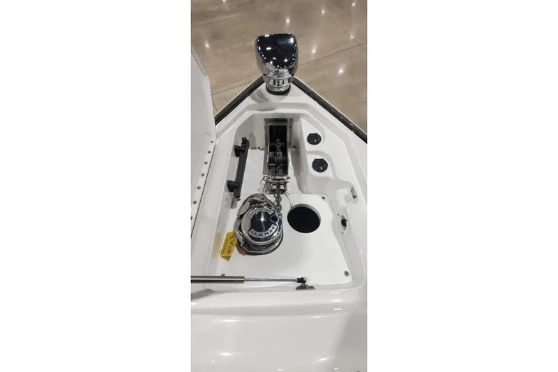 Slide: The Image of 2017 Formula 350 Crossover Bowrider anchor compartment with polished hardware and chain. - 49